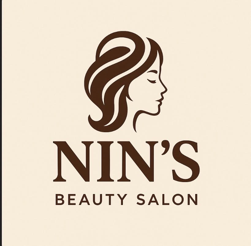 Nin's Beauty Salon logo, an elegant woman's profile in brown on cream